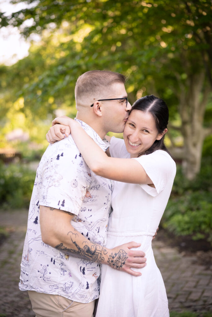 Romantic spring engagement photo in full bloom captured by Pamela Lepold Photography