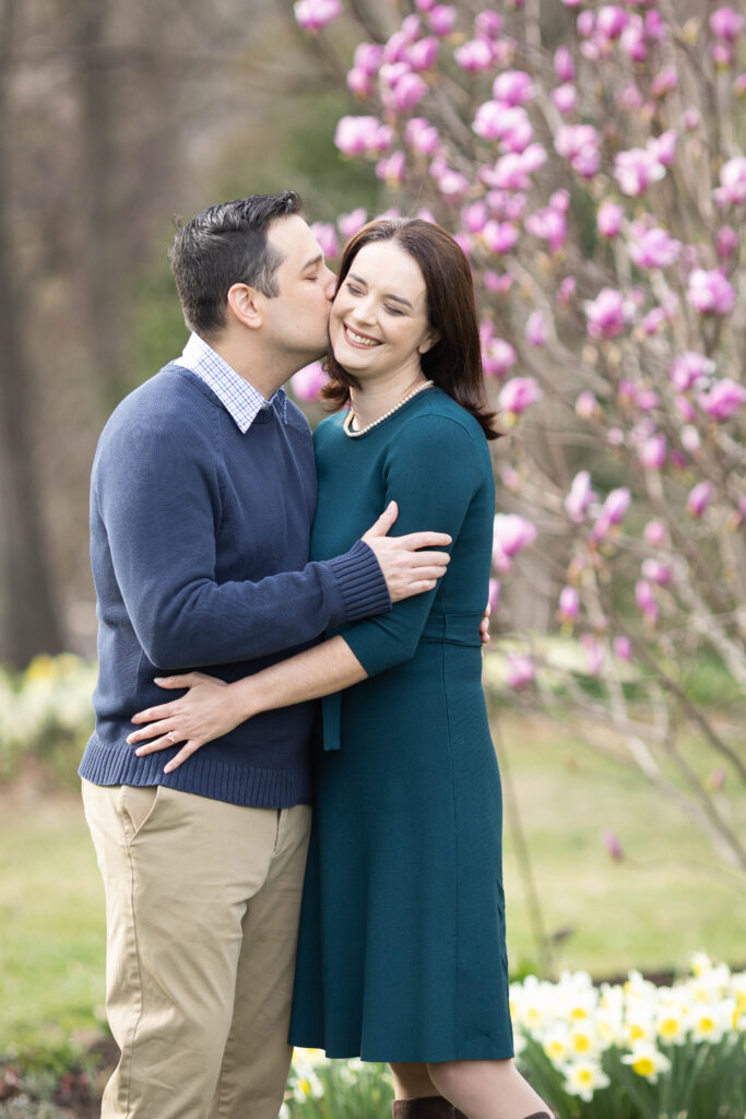 A romantic spring engagement session at Green Spring Gardens in Northern Virginia with cherry blossoms, laughter, and natural moments. Captured by Pamela Lepold Photography.