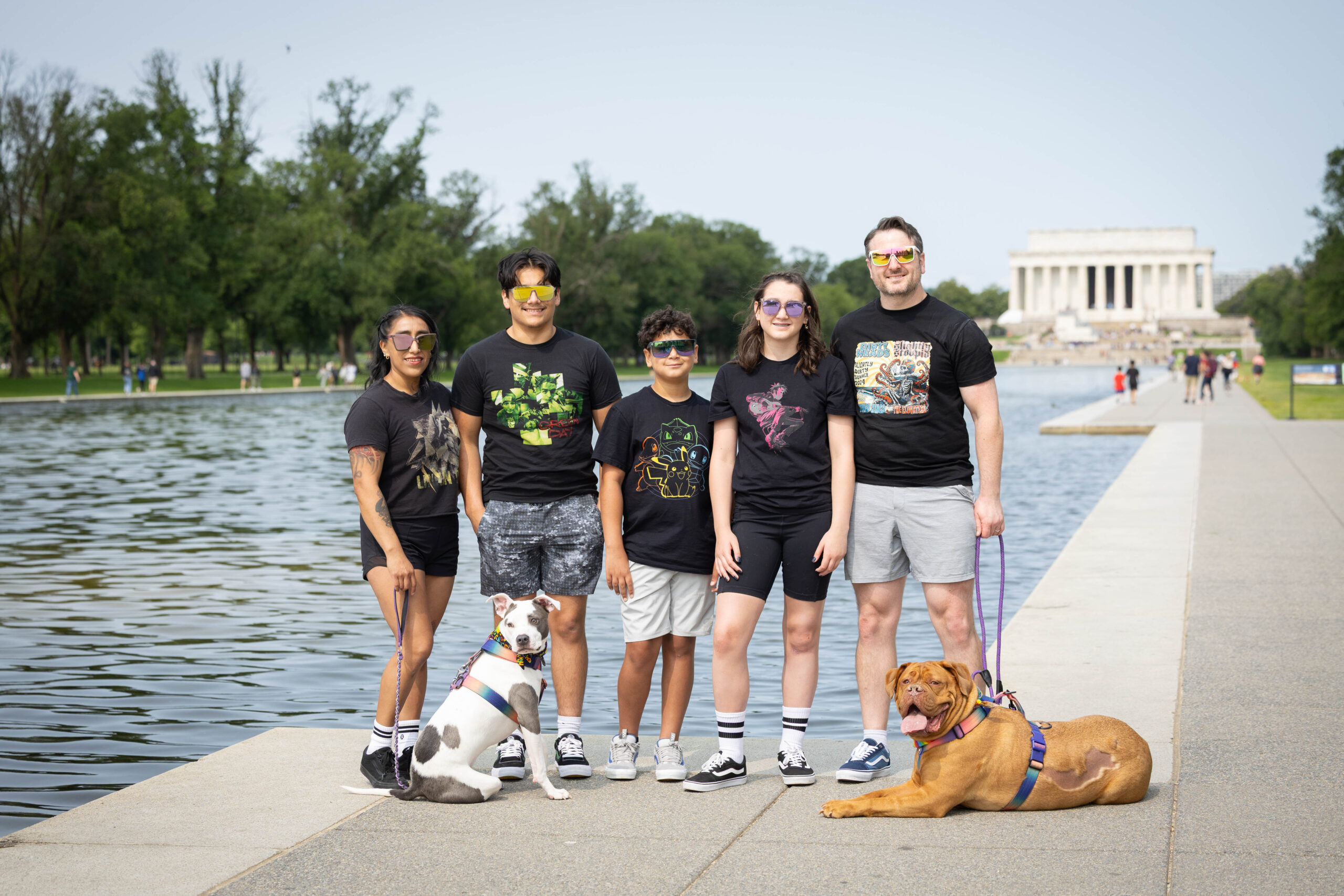 family poses for fun fit photos at the National Mall in DC
