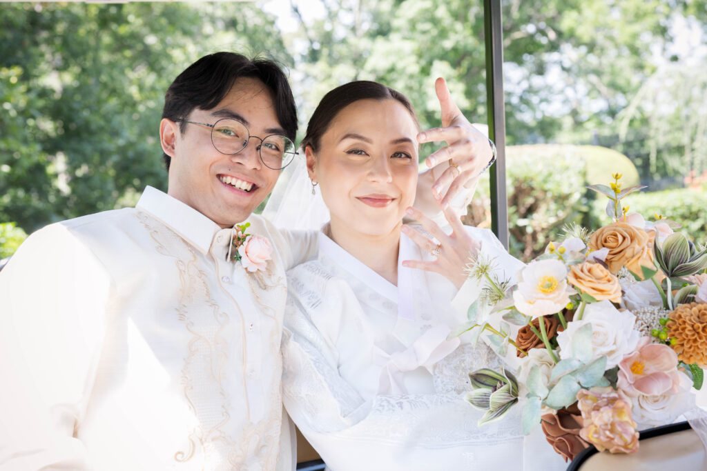 Joanna and Joshua in traditional Korean wedding attire at River Creek Club in Leesburg VA